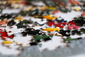 jigsaw puzzle unassembled on table 