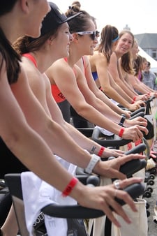 group of people on spin bikes