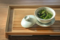 green tea in pot with lid off