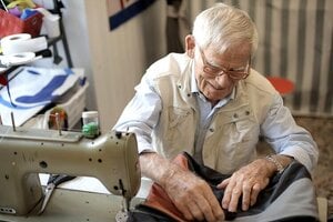 older gentleman using sewing machine