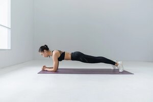 Foream plank exercise on yoga mat