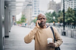 skeptical man phone telemarketing scams