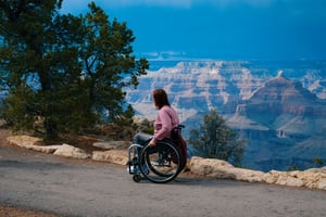 older woman in wheelchair going on scenic hike 